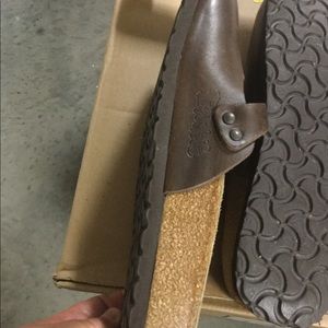 Birkenstock’s brown leather clogs.